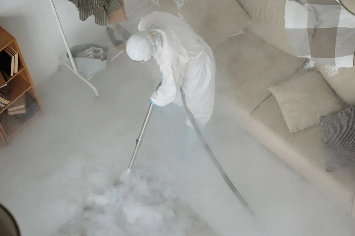 Biohazard cleanup technician in protective equipment, Olmos Park Terrace, San Antonio, TX